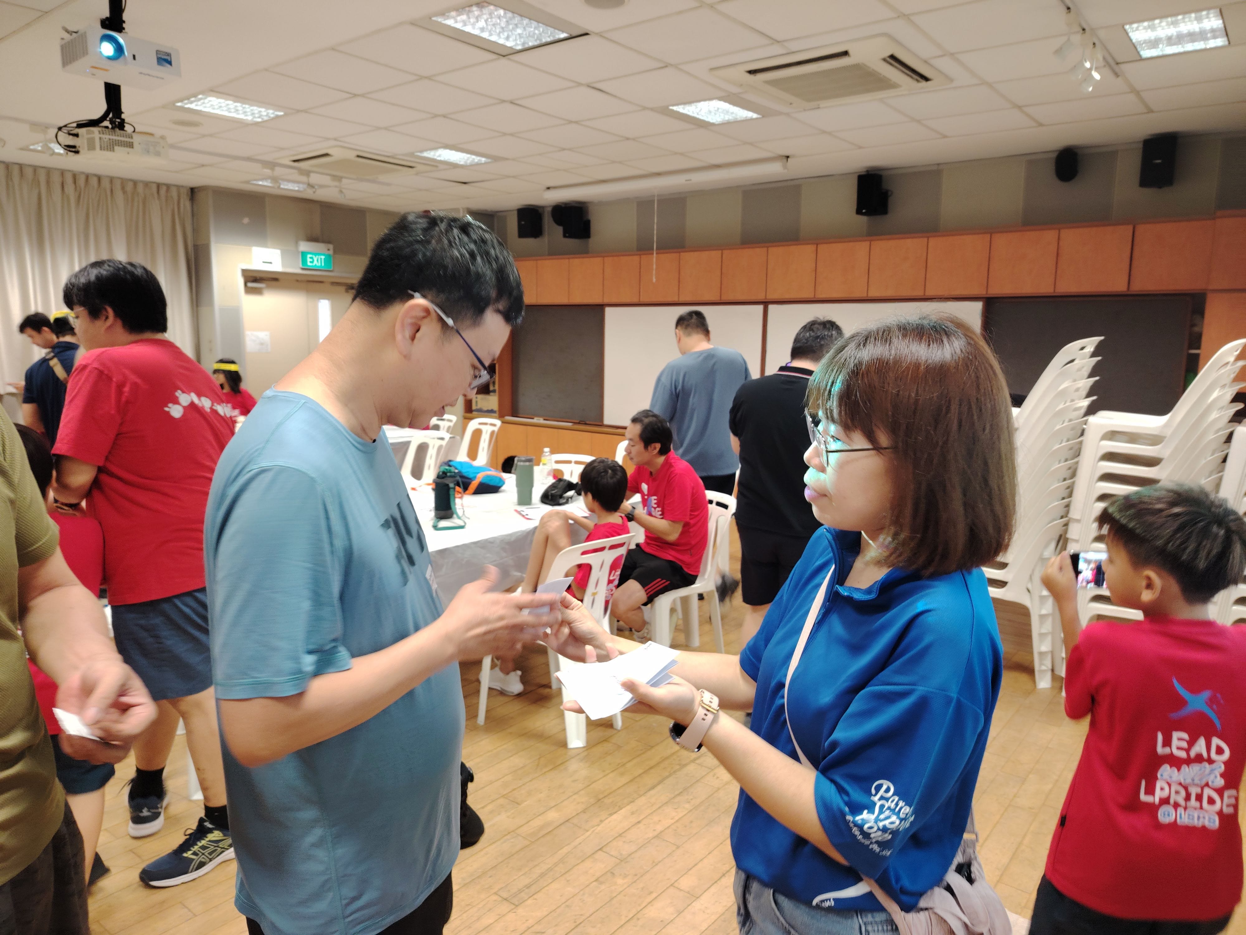 Players receiving a clue card to head to the next activity